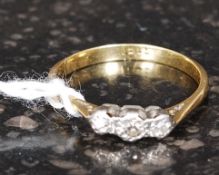 A vintage 18ct gold 3 stone diamond ring. Each diamond bezel mounted approx 10pnts total.