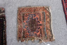 An interesting fragmentary Balouch bag having geometric borders etc - central medallion etc