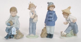 A collection of 4 Nao by Lladro figurines to include Boy with Rabbit & Bag, Girl Standing With Bag,