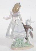 A Lladro figurine ' Alice in Wonderland ' Impressed factory marks 5740 to base also bearing  blue