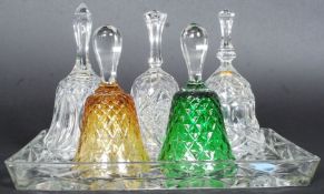 A group of five glass / crystal hand bells some coloured glass dating from the 20th century