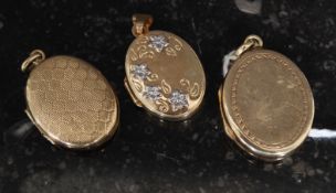 A collection of  three 9ct gold marked ladies necklace lockets / pendants.