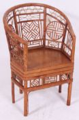 A decorative vintage 'Plantation' cane conservatory chair.