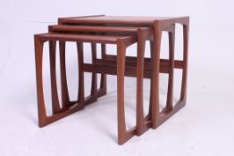 A vintage 1970's G-Plan teak wood nest of tables having graduating tops to each