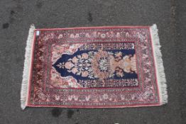 An Indian 100% silk pile prayer rug having blue central ground with tree of life design  surrounded
