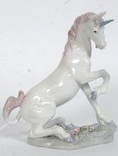 A Lladro Privilege porcelain figurine ' Magical Unicorn ' Model no 7697 impressed along with blue