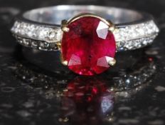 A stunning ladies 18ct white gold ruby and diamond ring. The 1.