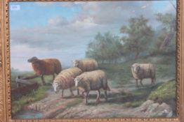 A 20th century oil on canvas painting of sheep being signed to the corner being framed and glazed.
