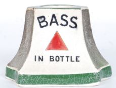 A vintage early 20th century ceramic Mintons Bass Advertising match strike with notation to each