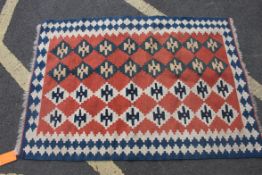A fabulous handwoven Kelim rug having rows of cream and blue stepped geometric pattern  over a