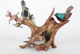 A limited edition Capo Di Monte 612/2000 Naples figurine of birds. Makers marks to base.
