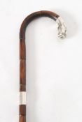 An Birmingham 1906 ebonised promenade cane bearing a hallmarked silver collar