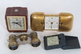 Europa brass travel clock along with a smaller cased travel clock,