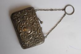 A silver hallmarked ladies purse and chain. Rococo scrollled design ( handle ( af) weight 39.