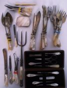 A collection of mother of pearl flatware and other items.