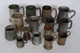 A collection of pewter and silver plate tankards from the 19th and 20th century to include various