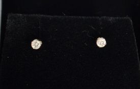 A pair of 14ct white gold diamond stud earrings