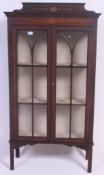 An Edwardian mahogany inlaid china - bookcase display cabinet.