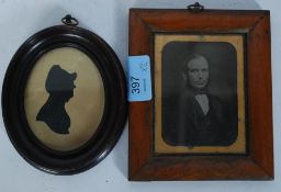 A framed silhouette of a lady in oval frame together with a 19th century maple framed ambrotype of