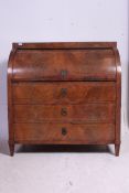 An early 19th century mahogany inlaid  cylinder top bureau desk with a fully fitted appointed