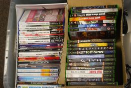 An XBOX computer console with controllers together with a PS2 console with controller.