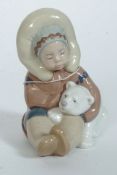 A Lladro figurine ' Eskimo Boy with Pet Polar Bear ' Bearing impressed model  No 1195 with blue