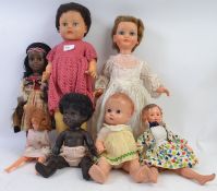 DOLLS: A collection of 7x assorted vintage dolls to include one stamped BND England, plastic dolls,