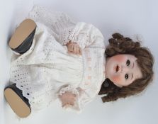 KAMMER & REINHARDT; An antique Kammer & Reinhardt German made  porcelain headed doll.
