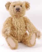 STEIFF; A Steiff large Golden mohair teddy bear 000560, with growler. Approx 42cm tall.