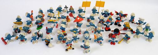 SMURFS; A collection of loose vintage Smurfs by Peyo and Schleich. Some with accessories.