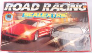 SCALEXTRIC; A boxed Scalextric racing car set - Road Racing - appears to be complete, with cars,