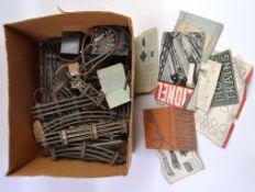 LIONEL TRAINS; A box of vintage Lionel 0 gauge branded railway trainset track, transformers,