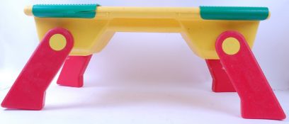 LEGO; A vintage Lego Play Table in red and yellow, with fold out legs.