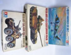 MODEL KITS; A collection of 3x vintage Tamiya model kits, two being tanks, the other a plane.