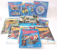 THUNDERBIRDS; A collection of Thunderbirds items to include 7x books, sealed figure,