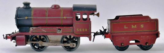 HORNBY; An original vintage Hornby 0 Gauge railway trainset clockwork locomotive and tender - 5600,