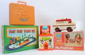 TOYS; A collection of vintage toys to include a Discovery Time Mr Postman,