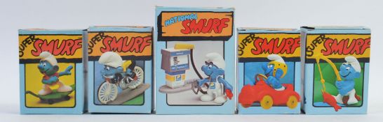 SMURFS; A good collection of 5x vintage Schleich boxed Smurfs, comprising of; Skateboarder, Cyclist,