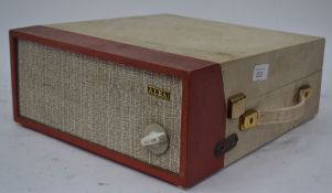 A small vintage two tone four speed  Alba portable record player, carry strap to side,