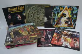 A collection of vinyl record LP's to include Rolling Stones, Beatles, Queen,