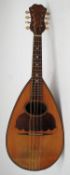 An early 20th century pear shaped bowl back mandolin ( Musical Instrument )  having paper label to