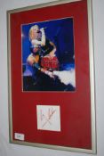 A framed and glazed autograph and photograph of Spice Girl Gerri Halliwell?

UK,