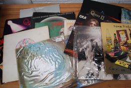 A quantity of Vinyl records dating from the 70's to include Queen, many titles, Pink Floyd,