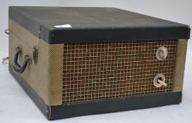 A vintage portable 1950's Decca Pilot four speed  record player.