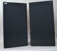 A pair of tall floor standing teak effect Goodman's RB - 65 speakers, removable covers

UK,