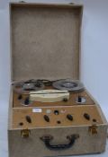 A vintage cased portable reel to reel recorder / player by Brenell of London, having lift up lid,