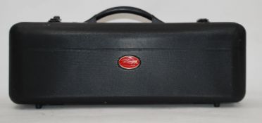 A Chinese made Alto sax by Stagg, in original case with several spare reeds.