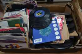 A large quantity of 45 rpm vinyl singles ( 200+ ) many artists and genres dating from the 1960's