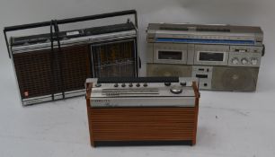 A collection of 3 vintage radios together with a retro tape player.