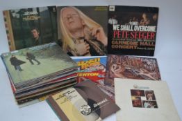 A collection of vinyl records to include various artists such as Queen, Jerry Rafferty,